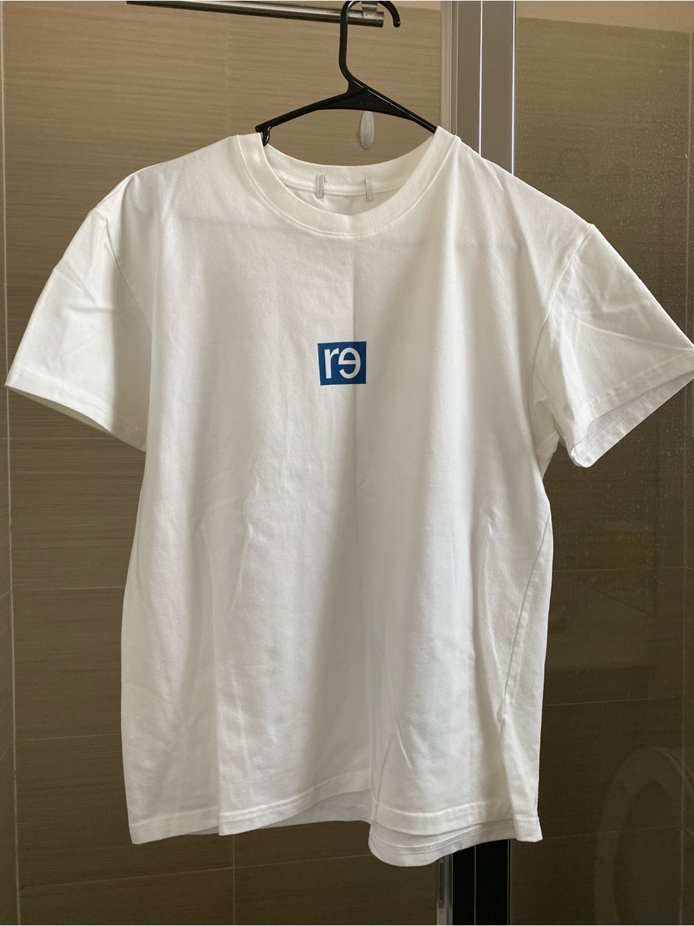Women's White Short Sleeve Tee with Center Blue Logo